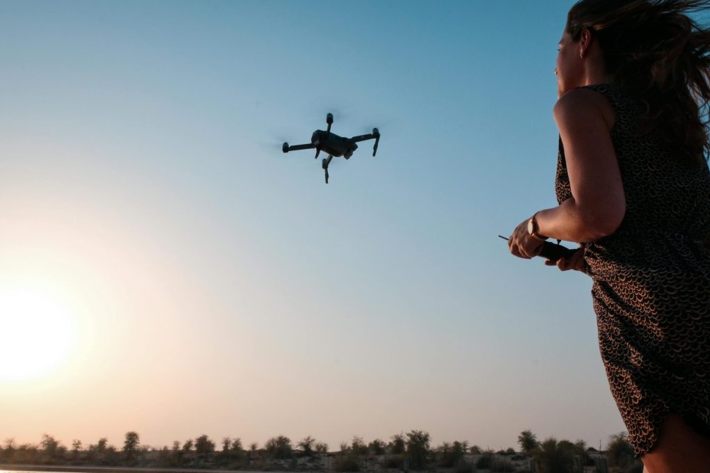 Lady flying a drone